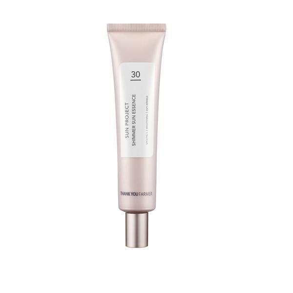 Thank you farmer Sun Project Shimmer Sun Essence SPF 30 PA++40ml 1 Thank You Farmer Sun Project Shimmer Sun Essence SPF 30 PA++ 40ml tube for radiant sun protection and luminous skin finish 2. Image Description A 40ml tube of Thank You Farmer Sun Project Shimmer Sun Essence with elegant, soft-toned packaging. This Korean sunscreen offers SPF 30 PA++ protection with a subtle pearlescent glow. Infused with niacinamide, aloe vera, and flower extracts, it hydrates, brightens, and enhances skin radiance while protecting against UV damage. Ideal for dull, dry, and normal skin types. 3. Meta Title Thank You Farmer Shimmer Sun Essence SPF 30 PA++ 40ml | Glowy Sunscreen for Radiant Skin 4. Meta Description Get sun protection with a glow using Thank You Farmer Shimmer Sun Essence. This 40ml SPF 30 PA++ formula hydrates, brightens, and leaves a luminous finish. 5. Product Short Description A lightweight sunscreen with SPF 30 PA++ and a soft shimmer to hydrate, protect, and illuminate dull or tired skin. 6. Product Long Description Thank You Farmer Sun Project Shimmer Sun Essence SPF 30 PA++ 40ml is a radiant-finish sunscreen designed to protect and enhance your complexion. Its light-reflecting shimmer particles give skin a healthy glow, while niacinamide and aloe vera hydrate and soothe. The formula also includes calendula, lotus, and hibiscus extracts to nourish and brighten, making it perfect for daily wear under makeup or on bare skin. This essence-textured sunscreen absorbs quickly, leaving no white cast or greasiness—just a soft, luminous finish that flatters all skin tones. Key Ingredients & Benefits: - ☀️ SPF 30 PA++: Protects against UVA and UVB rays - ✨ Pearlescent Pigments: Add a natural glow and brighten dull skin - 💧 Niacinamide & Aloe Vera: Hydrate and soothe irritation - 🌸 Calendula, Lotus & Hibiscus Extracts: Nourish and improve skin tone - 🧬 Glycerin & Betaine: Maintain moisture balance and softness Why You’ll Love It: - Lightweight, essence-like texture - Subtle shimmer for radiant finish - Ideal for dull, dry, and normal skin types - Vegan, cruelty-free, and free from parabens and artificial fragrance - Made in Korea and dermatologist-tested How to Use: Apply a generous amount to face and neck as the final step in your morning skincare routine. Pat gently until absorbed. Reapply every 2–3 hours when exposed to sunlight. Want help bundling this with Thank You Farmer’s Glow Balm or Rice Pure Gel and Cream? I can build a full radiance-boosting routine that protects, hydrates, and leaves your skin glowing all day.